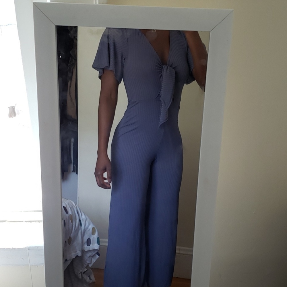 Purple jumpsuit.